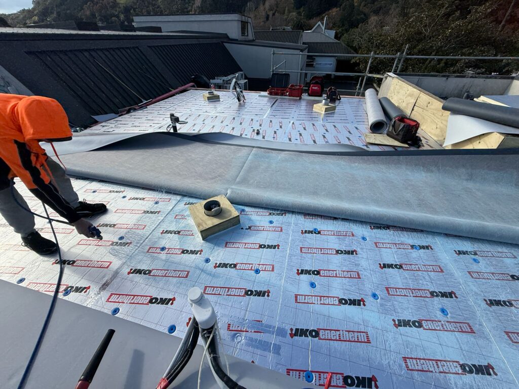 110 mm PIR insulation and TPO fleece-back membrane installation